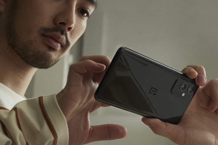 Male Model Holding a OnePlus Camera