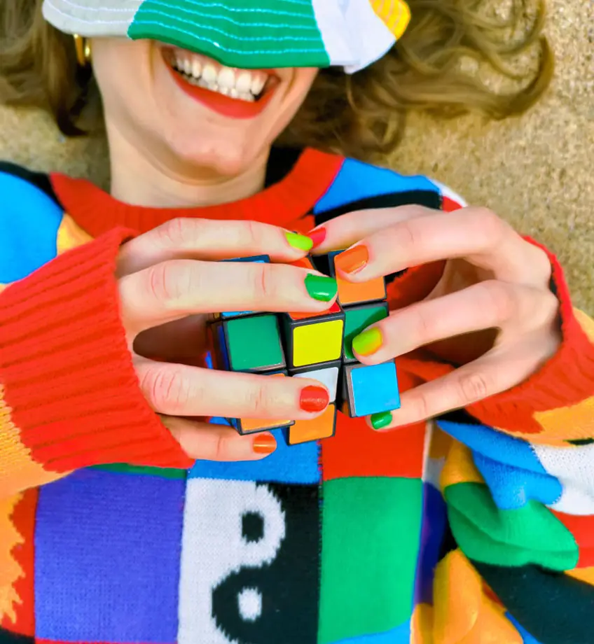 A Female Model Solving Rubik's Cube Blindfolded